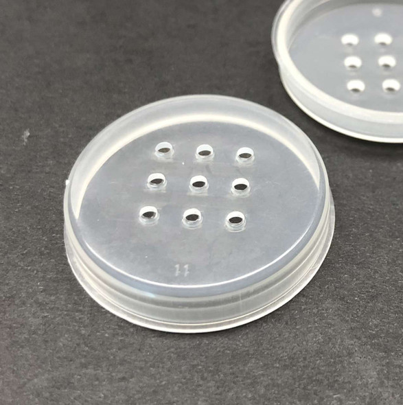 2 sifters for cosmetic jars with one up side down 