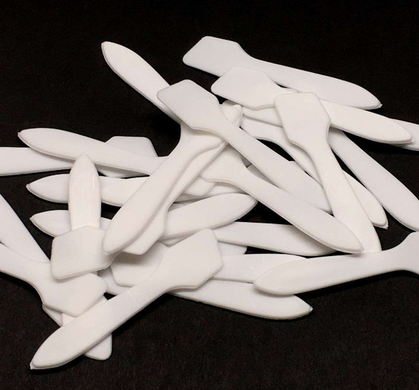 A bunch of cosmetic spatulas white angled beauty makeup mixing tool
