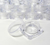 Small square cosmetic sample jars with clear caps