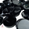 Beauty container caps in black for 10 ml cosmetic jars.