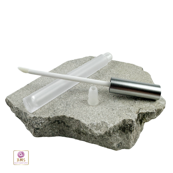 Slip lip gloss tube with frosted body and silver cap attached to a doefoot applicator